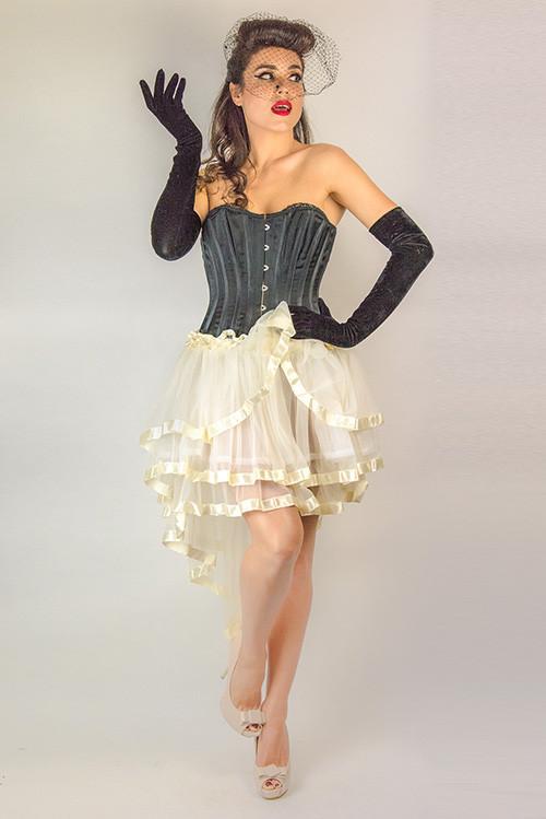 black corset and white layered, see-through lace skirt. 