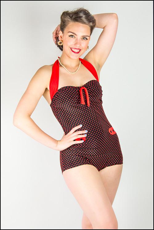 Polka dot red and black vintage swimsuit with a ribbon round the neck